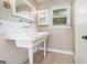 Bright bathroom with a classic pedestal sink and subway tile backsplash at 650 Moseley Rd, Stockbridge, GA 30281