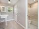 Neutral bathroom featuring a bathtub, white toilet, and a pedestal sink at 650 Moseley Rd, Stockbridge, GA 30281