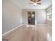 Neutral bedroom featuring hardwood floors and a glimpse of the bathroom at 650 Moseley Rd, Stockbridge, GA 30281