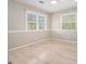 Cozy bedroom featuring hardwood floors and ample natural light at 650 Moseley Rd, Stockbridge, GA 30281