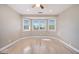 Light-filled bedroom boasting a ceiling fan, recessed lights, and large windows at 650 Moseley Rd, Stockbridge, GA 30281