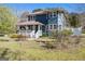Attractive two-story home featuring a cozy front porch and a charming architectural design, surrounded by a verdant lawn at 650 Moseley Rd, Stockbridge, GA 30281