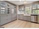 Bright kitchen featuring stainless steel appliances, white countertops, and a farmhouse sink at 650 Moseley Rd, Stockbridge, GA 30281