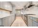 Spacious kitchen showcasing stainless steel appliances, subway tile backsplash, and gray cabinets at 650 Moseley Rd, Stockbridge, GA 30281