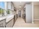 Bright kitchen featuring stainless steel appliances, white countertops, and undermount farmhouse sink at 650 Moseley Rd, Stockbridge, GA 30281