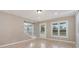 Bright living room with hardwood floors, trim, a doorway, and natural light from the windows at 650 Moseley Rd, Stockbridge, GA 30281