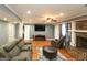 Finished basement featuring wood flooring, recessed lighting, and comfortable seating at 3798 Cumberland Way, Lithonia, GA 30038