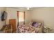 Comfortable bedroom featuring a ceiling fan, a window with curtains, and a dresser for storage at 3798 Cumberland Way, Lithonia, GA 30038
