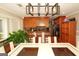 Bright dining area featuring modern lighting, breakfast bar, and stainless steel appliances at 3798 Cumberland Way, Lithonia, GA 30038
