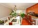Open concept dining area with modern seating and breakfast bar at 3798 Cumberland Way, Lithonia, GA 30038
