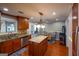 Open concept kitchen with granite island, stainless steel appliances, and wood cabinets at 3798 Cumberland Way, Lithonia, GA 30038