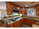 Well-equipped kitchen featuring granite countertops, stainless steel appliances, and ample cabinetry at 3798 Cumberland Way, Lithonia, GA 30038