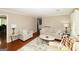 Bright and inviting living room featuring hardwood floors, neutral furniture, and stylish decor at 3798 Cumberland Way, Lithonia, GA 30038