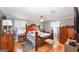 Main bedroom featuring hardwood floors, large bed, and beautiful decor at 3798 Cumberland Way, Lithonia, GA 30038