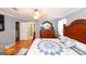 This main bedroom features hardwood floors, a large bed, and a spacious closet at 3798 Cumberland Way, Lithonia, GA 30038