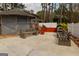 Outdoor patio with built-in benches, a grill area, and adjacent gazebo, perfect for entertaining and outdoor cooking at 3798 Cumberland Way, Lithonia, GA 30038