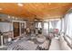 Relaxing screened porch with comfortable seating and ceiling fan at 3798 Cumberland Way, Lithonia, GA 30038