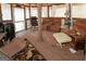 Cozy sunroom with comfortable seating, carpeted floors, and bright natural light at 3798 Cumberland Way, Lithonia, GA 30038
