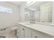 Bright bathroom featuring white cabinets, quartz countertop, and tile flooring at 4967 Post Road Pass, Stone Mountain, GA 30088