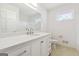 Bright bathroom featuring white cabinets, quartz countertop, and tile flooring at 4967 Post Road Pass, Stone Mountain, GA 30088