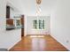 Elegant dining room boasts hardwood floors, modern lighting, and abundant natural light at 4967 Post Road Pass, Stone Mountain, GA 30088