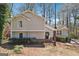 Charming two-story home features a well-maintained yard and inviting front entrance at 4967 Post Road Pass, Stone Mountain, GA 30088
