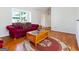 Bright living room features hardwood floors, a large window, and ample seating at 4967 Post Road Pass, Stone Mountain, GA 30088