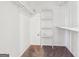 Bright walk-in closet with carpet and built-in shelving at 4967 Post Road Pass, Stone Mountain, GA 30088