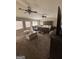 Large main bedroom featuring a king-sized bed, two ceiling fans and lots of natural light at 132 Carson Rd, Brooks, GA 30205