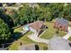 Aerial view of estate home with a luxurious in-ground swimming pool, well-manicured lawn and circular driveway at 3015 Gold Creek Dr, Villa Rica, GA 30180