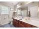 Bathroom featuring a double vanity, modern fixtures, and patterned shower curtain at 3015 Gold Creek Dr, Villa Rica, GA 30180