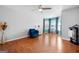 Spacious bedroom with hardwood floors, blue arm chair, and bay window seating at 3015 Gold Creek Dr, Villa Rica, GA 30180