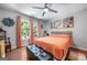 Bright bedroom with decorative artwork, accent floral arrangements, and hardwood floors at 3015 Gold Creek Dr, Villa Rica, GA 30180