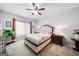 Serene bedroom featuring warm light, a ceiling fan, and plush carpet flooring at 3015 Gold Creek Dr, Villa Rica, GA 30180