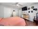 Spacious bedroom with modern lighting, television, and custom decor at 3015 Gold Creek Dr, Villa Rica, GA 30180