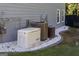 Home exterior with generator and two HVAC units, surrounded by white gravel and stone trim at 3015 Gold Creek Dr, Villa Rica, GA 30180
