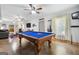 This is a large game room with a blue pool table and multiple ceiling fans at 3015 Gold Creek Dr, Villa Rica, GA 30180