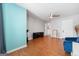 Open-concept living room featuring a cozy blue armchair and modern lighting fixtures at 3015 Gold Creek Dr, Villa Rica, GA 30180