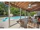 Outdoor patio with comfortable seating next to a large backyard swimming pool at 3015 Gold Creek Dr, Villa Rica, GA 30180