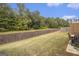 The backyard features a long fence and patio table at 11882 Fuller St, Hampton, GA 30228