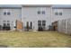 Backyard features a grass lawn and patio with seating at 11882 Fuller St, Hampton, GA 30228