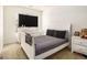 This bedroom features a bed, dresser, bedside table, and TV at 11882 Fuller St, Hampton, GA 30228