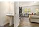 Cozy living room and powder room combination, creating a comfortable living space with easy access to amenities at 11882 Fuller St, Hampton, GA 30228