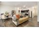 Open-concept living area featuring a comfortable sofa, dining table, and a well-equipped kitchen at 11882 Fuller St, Hampton, GA 30228