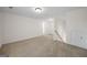 Open bonus room with neutral carpet and multiple access doors at 105 Creekside Knl, Grantville, GA 30220