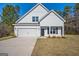 Beautiful two-story home with a two-car garage, complemented by a well-maintained lawn at 105 Creekside Knl, Grantville, GA 30220