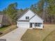 This stunning two-story home boasts a two-car garage, complete with a private driveway and scenic lawn at 105 Creekside Knl, Grantville, GA 30220