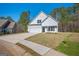 This two-story home includes a two-car garage, complemented by a spacious driveway and a neatly kept lawn at 105 Creekside Knl, Grantville, GA 30220