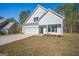 Attractive two-story home boasts a two-car garage, framed by a lush green lawn at 105 Creekside Knl, Grantville, GA 30220