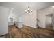 Open-concept kitchen with stainless steel appliances and island at 105 Creekside Knl, Grantville, GA 30220